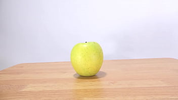 Woman's hand grabs an apple